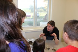 Scientist Leila Desotelle talks with students about stream macro-invertebrates at Kellogg Biological Station. 